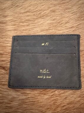 n.d.c. black leather card holder with gold foil logo